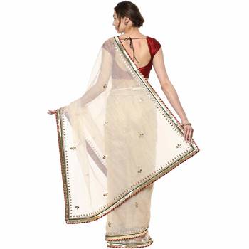 Beige embroidered tissue saree with blouse 2
