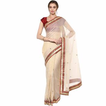 Beige embroidered tissue saree with blouse 1