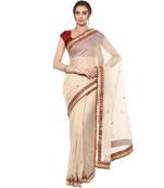 Beige embroidered tissue saree with blouse