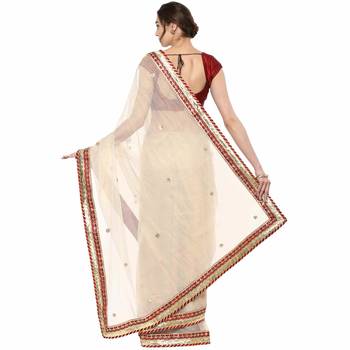 Beige embroidered tissue saree with blouse 2