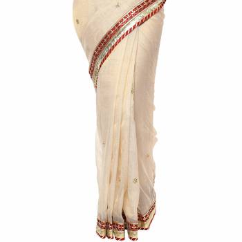 Beige embroidered tissue saree with blouse 3
