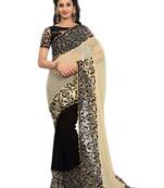 Cream embroidered georgette saree with blouse