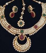 Dazzling polki with festive stonework India maroon green pearl necklace set