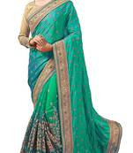 Green embroidered silk & net saree with blouse