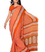 Orange printed faux georgette saree with blouse