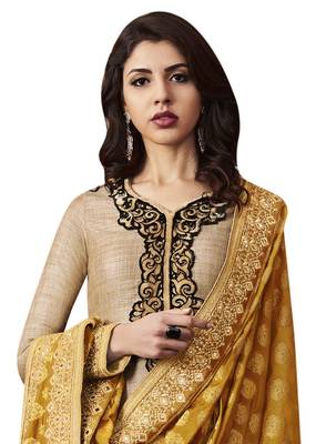 Beige coloured Raw Silk semi stitched ethnic suits 2