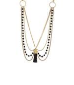 layered beaded necklace in gold tone with central drop of edgy black stone