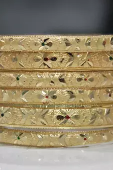 Set Of 6 Gold Dyed Bracelets With Intricate Floral Design