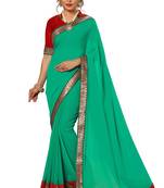 Green embroidered satin saree with blouse