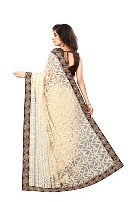 Beige embroidered net saree with blouse 2