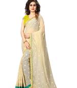 Beige embroidered georgette saree with blouse