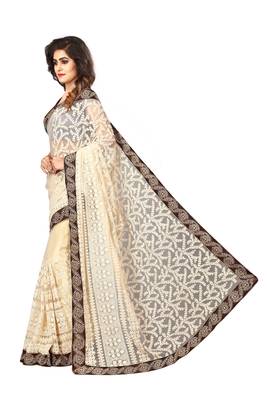 Beige embroidered net saree with blouse 3
