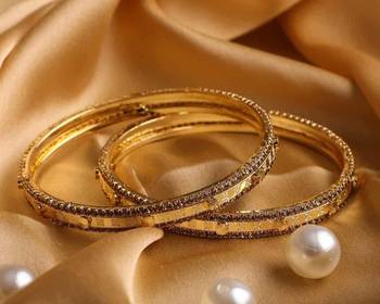 Pair Of Golden Bracelets With Golden Stonework For Dailywear 1