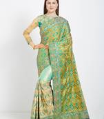 Green color silk jacquard and lycra saree with blouse