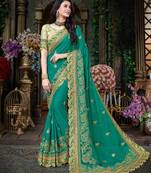 Sea green embroidered georgette saree with blouse