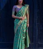 Green woven banarasi saree with blouse