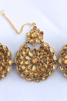 Reeti Fashions - Golden round motif stone studded earrings with maang tikka set for women