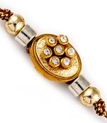 Floral Shape Ad Studded Golden Base Rakhi
