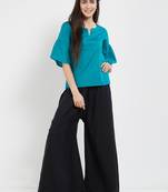 Teal green top with flaired sleeves with gathers