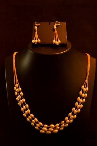 Designer pearl stone golden chain necklace set with matching earrings