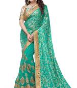 Turquoise embroidered brasso saree with blouse