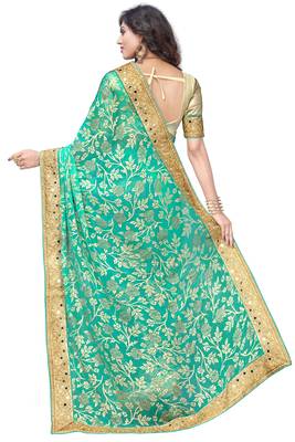 Turquoise embroidered brasso saree with blouse 2