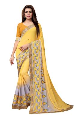 Yellow embroidered georgette saree with blouse 1