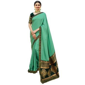 Green woven faux georgette saree with blouse 1