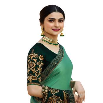 Green woven faux georgette saree with blouse 2