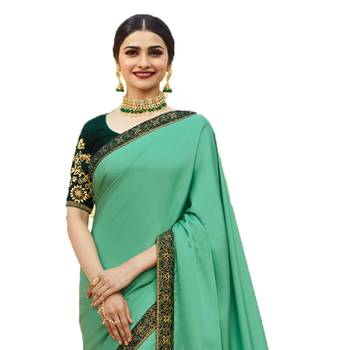Green woven faux georgette saree with blouse 3