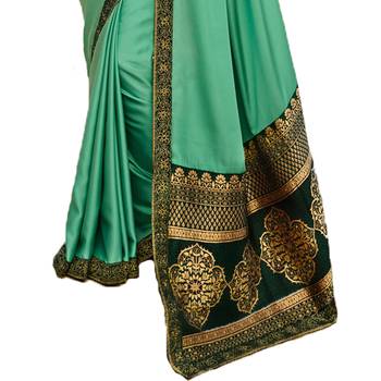 Green woven faux georgette saree with blouse 4