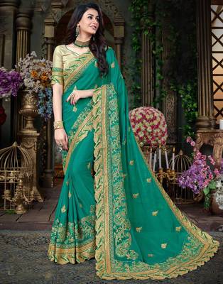 Blue embroidered georgette saree with blouse 1