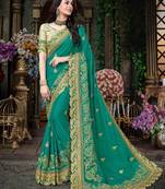 Blue embroidered georgette saree with blouse
