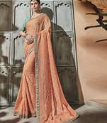 Peach embroidered silk saree with blouse