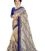 Beige embroidered net saree with blouse
