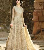Beige embroidered net salwar with dupatta