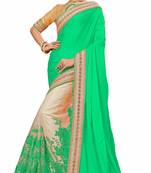 Green embroidered satin saree with blouse