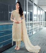 Beige embroidered net salwar with dupatta