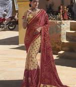 Beige embroidered georgette saree with blouse