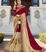 Maroon and golden embroidered georgette saree with blouse