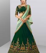 Stunning Dark Green Colored Beautifully Embroidered Tapeta Silk Lehenga Choli For Wedding