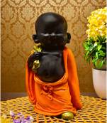 Karigaari India Handcrafted Resine Little Orange Buddha Monk Sculpture