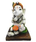 Karigaari Resine India Dhoti Ganesha Eating Ladoo Showpiece (Green, Standard Size)