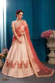 Mesmerizing Peach Colored Resham And Zari Embroidered with stone work Satin fabric lehenga choli for bride