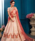 Mesmerizing Peach Colored Resham And Zari Embroidered with stone work Satin fabric lehenga choli for bride