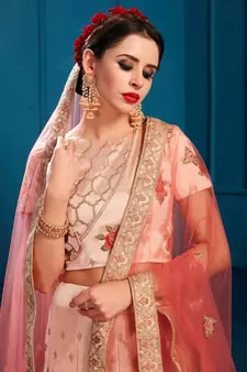 Mesmerizing Peach Colored Resham And Zari Embroidered with stone work Satin fabric lehenga choli for bride