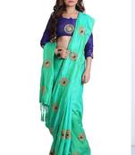 Turquoise green paper silk embroidered saree with unstitched blouse