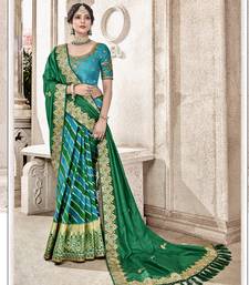 Green embroidered silk blend saree with blouse