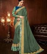 Green embroidered silk blend saree with blouse