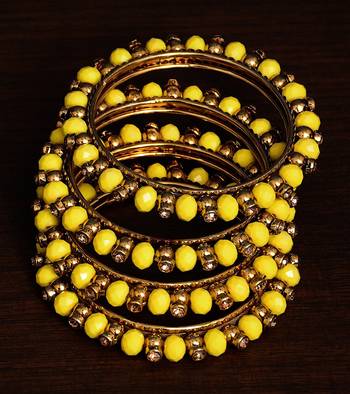 Light yellow beaded and zircon stone embellished two pairs of designer bangles for women 1